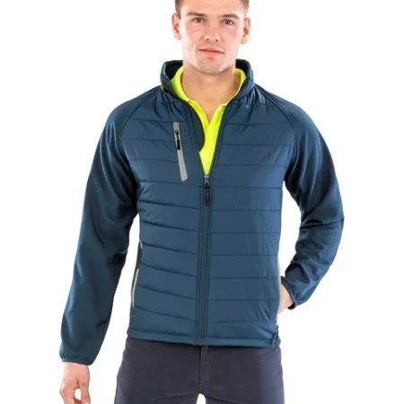 Result R237X Compass-Colour trim, softshell with on-trend padding for extra warmth. It is showerproof, breathable, and windproof.